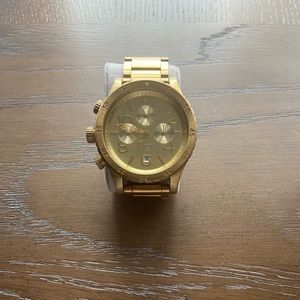 Nixon gold mens watch